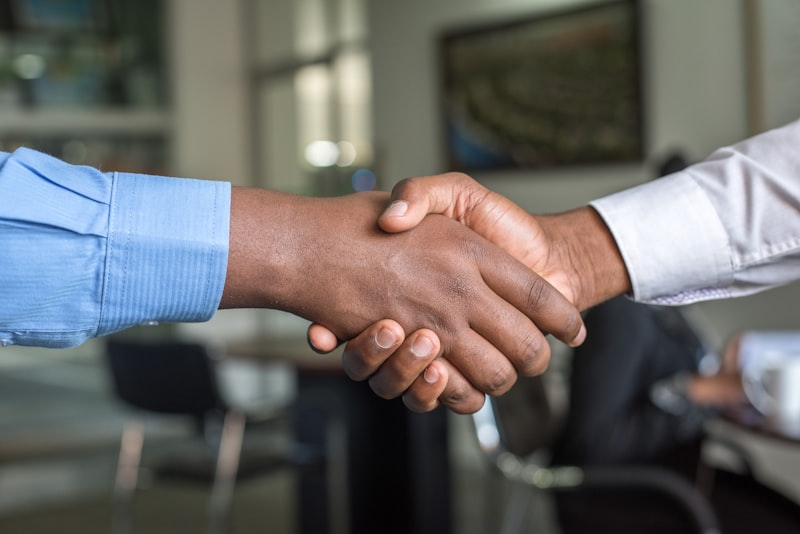 Professional business handshake representing a new client partnership